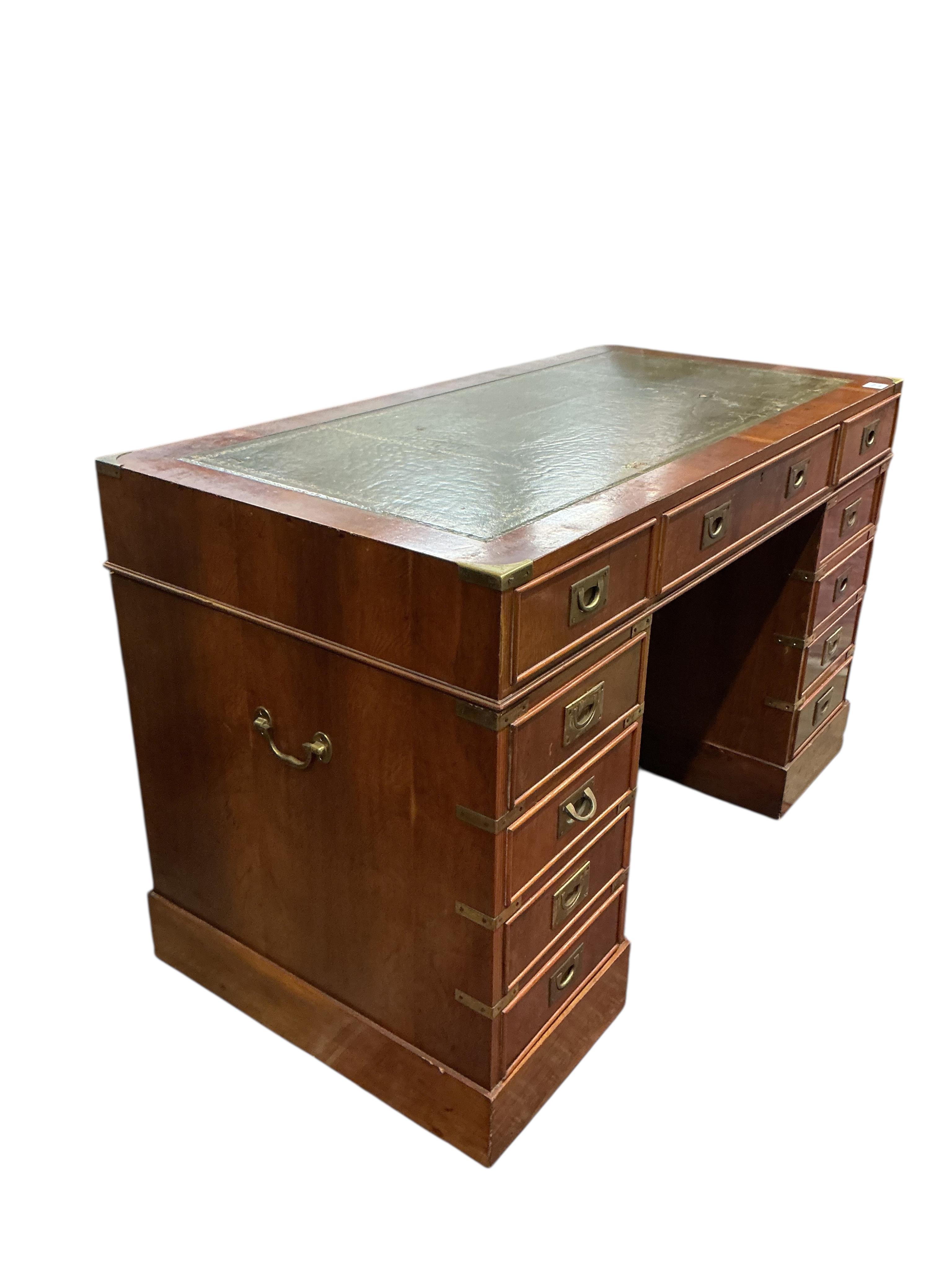 A reproduction brass mounted yew pedestal desk, width 121cm, depth 60cm, height 76cm